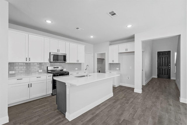 kitchen featuring white cabinetry, appliances with stainless steel finishes, and sink