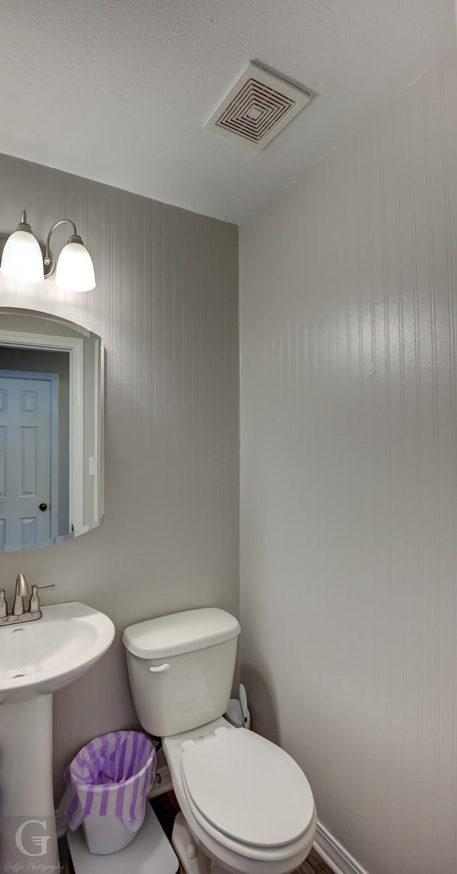 bathroom with toilet and sink