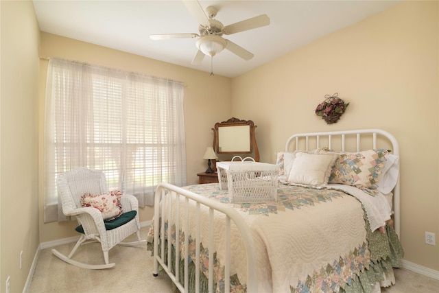 bedroom with light colored carpet and ceiling fan