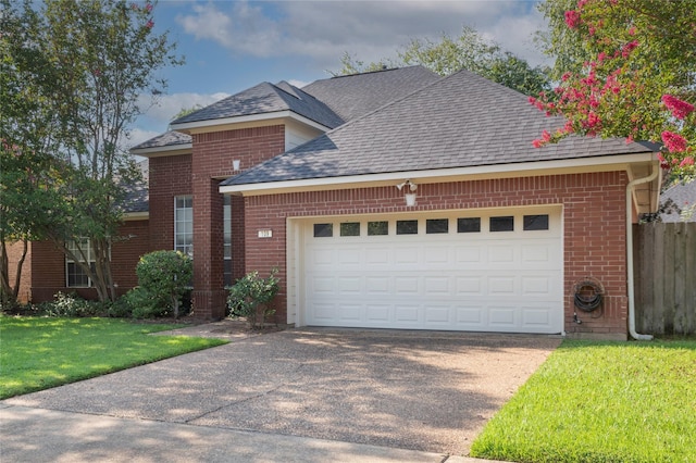 front of property featuring a garage and a front yard