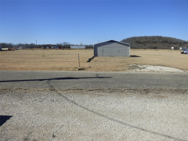 view of road featuring a rural view