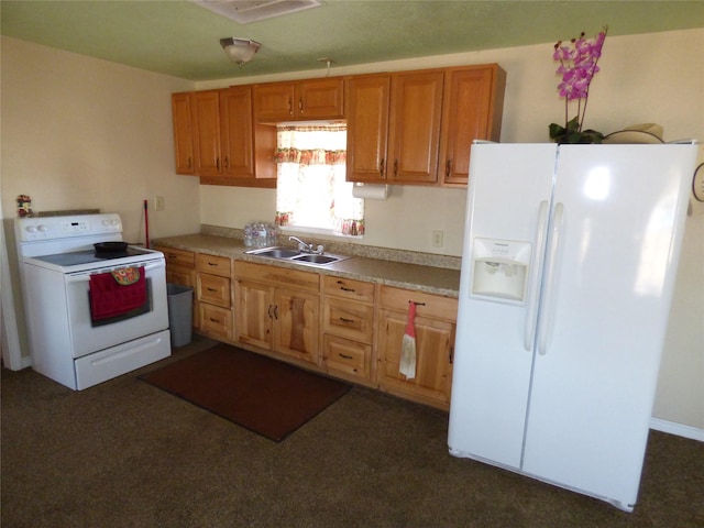 kitchen featuring light countertops, white appliances, brown cabinetry, and a sink