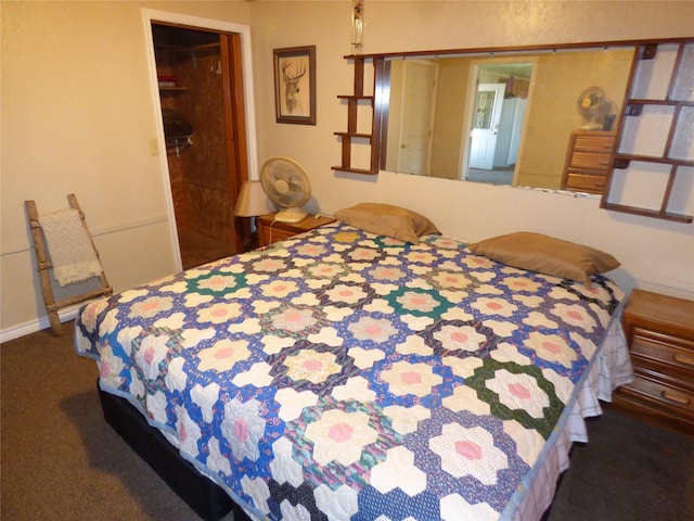 bedroom with dark colored carpet