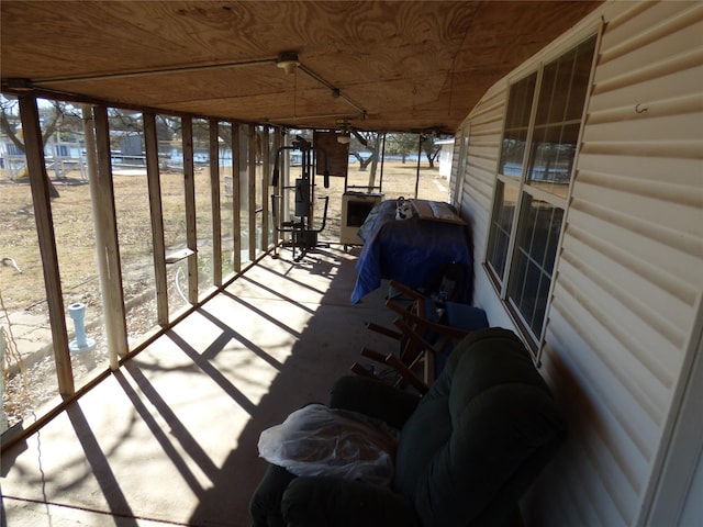 unfurnished sunroom featuring a healthy amount of sunlight