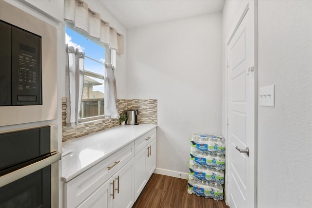 bathroom featuring tasteful backsplash and hardwood / wood-style floors