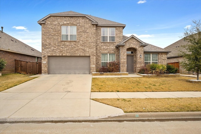 view of property with a garage and a front lawn