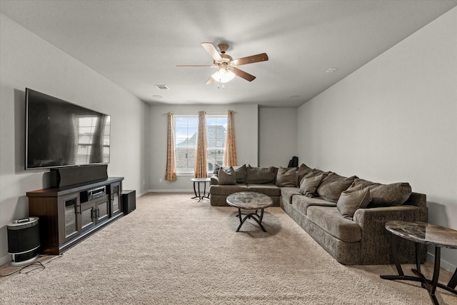 carpeted living room featuring ceiling fan