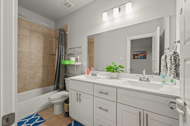 full bathroom featuring tile patterned flooring, vanity, shower / tub combo with curtain, and toilet