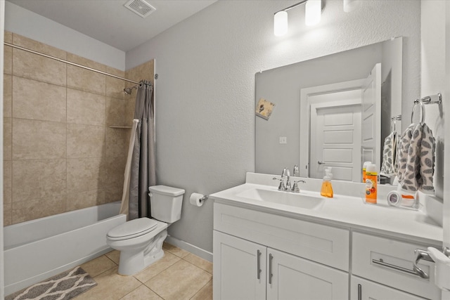 full bathroom with tile patterned flooring, vanity, shower / tub combo, and toilet