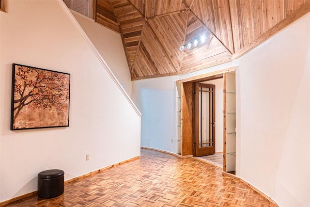 interior space featuring a high ceiling and light parquet flooring