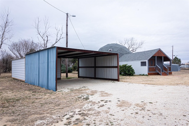 view of outdoor structure with a carport