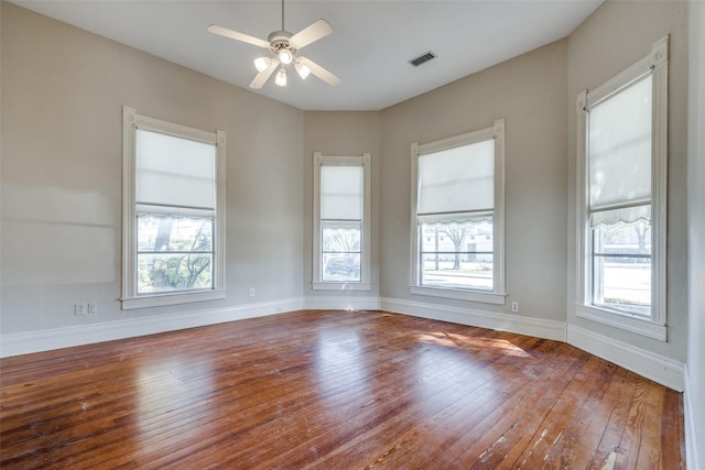 empty room featuring ceiling fan and wood-type flooring