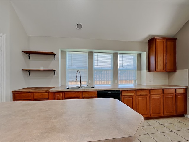 kitchen with dishwasher, vaulted ceiling, sink, and tasteful backsplash