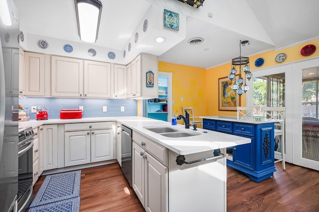 kitchen with white cabinetry, a center island, sink, and hanging light fixtures