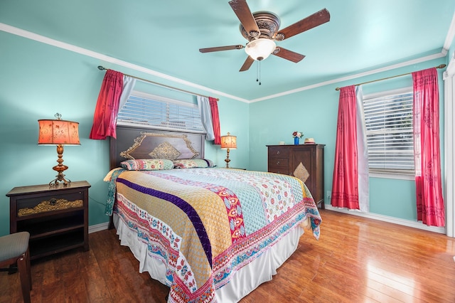 bedroom with crown molding, ceiling fan, and hardwood / wood-style floors