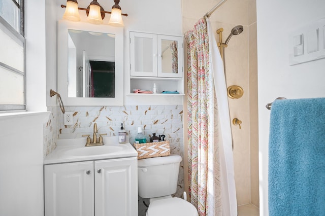 bathroom with tile walls, decorative backsplash, vanity, walk in shower, and toilet