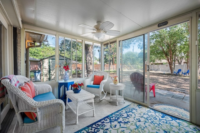 sunroom / solarium with ceiling fan