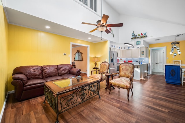 living room with high vaulted ceiling, dark hardwood / wood-style floors, and ceiling fan