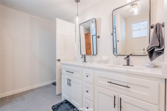 bathroom with tile patterned flooring and vanity