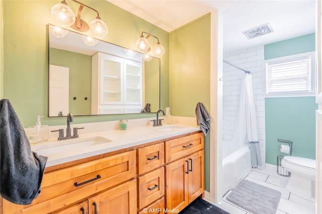 full bathroom featuring tile patterned floors, toilet, shower / tub combo, and vanity