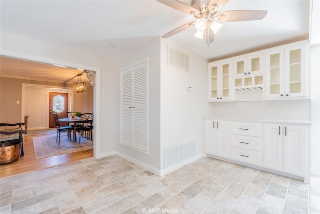 interior space featuring ceiling fan