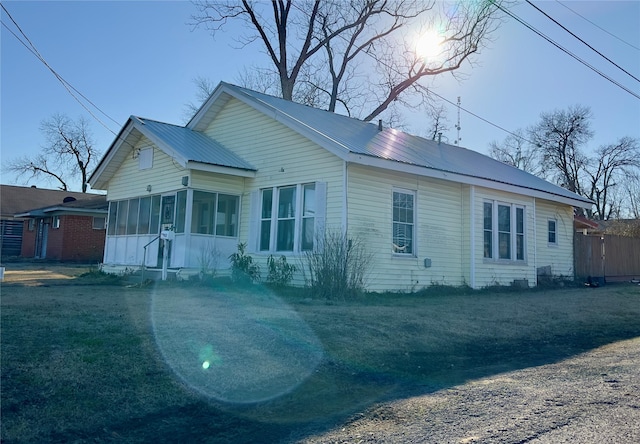 view of front of home with a sunroom