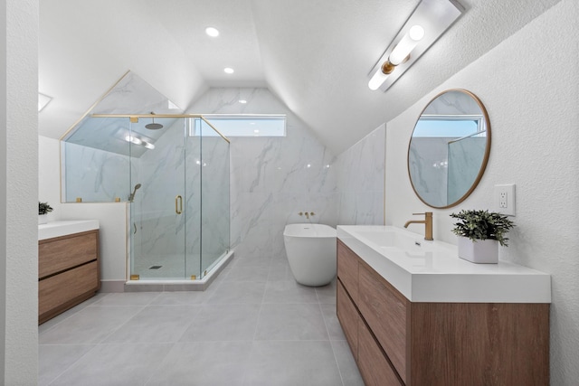 bathroom featuring vanity, vaulted ceiling, tile patterned floors, and independent shower and bath