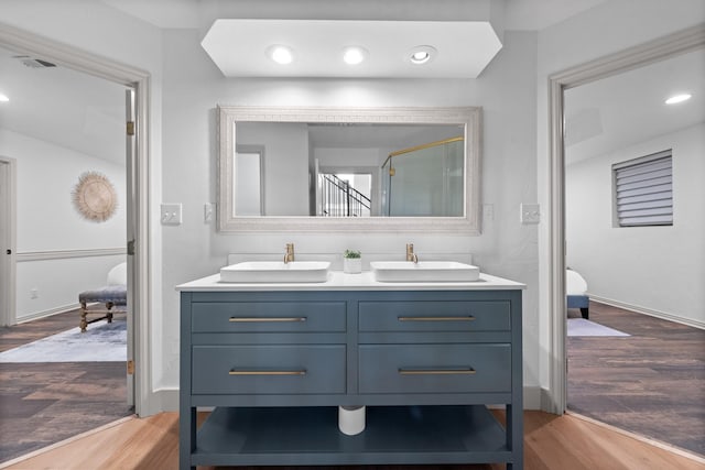 bathroom featuring wood-type flooring and vanity