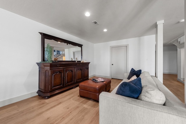 living room with light hardwood / wood-style floors