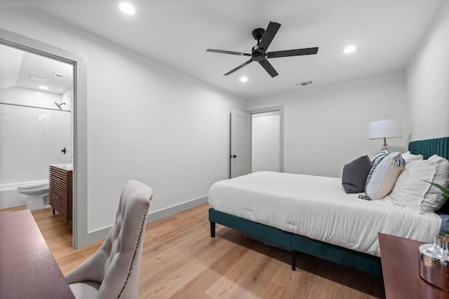 bedroom with ensuite bathroom, ceiling fan, and light hardwood / wood-style flooring