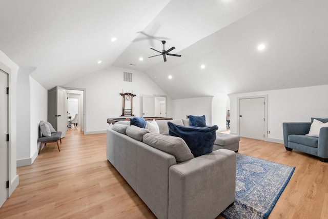 living room with ceiling fan, lofted ceiling, and light hardwood / wood-style floors