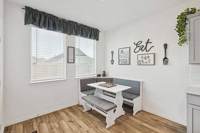 dining room featuring light wood-type flooring and breakfast area