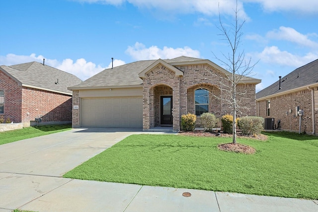 view of front of property featuring a garage, central air condition unit, and a front lawn