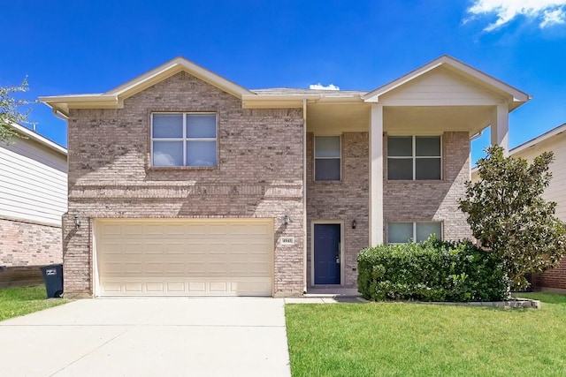 front of property with a garage and a front lawn