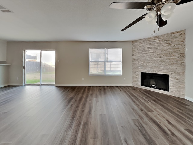 unfurnished living room with hardwood / wood-style flooring and a fireplace