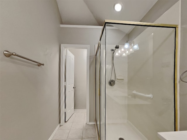 bathroom featuring vaulted ceiling, tile patterned floors, and walk in shower