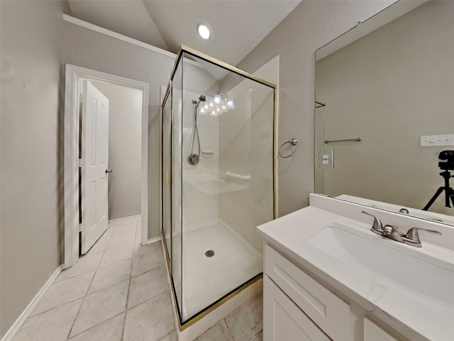 bathroom featuring walk in shower, tile patterned floors, vaulted ceiling, and vanity