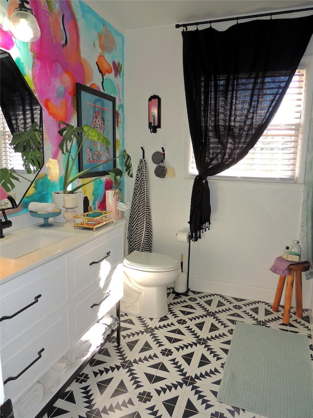 bathroom featuring vanity and toilet