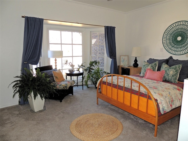 bedroom featuring ornamental molding and carpet