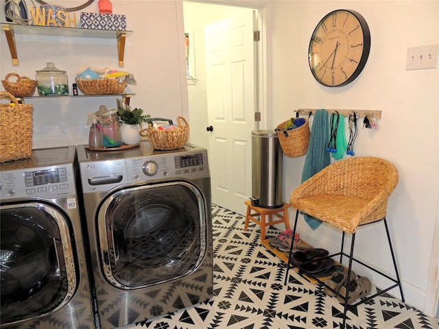 clothes washing area with separate washer and dryer