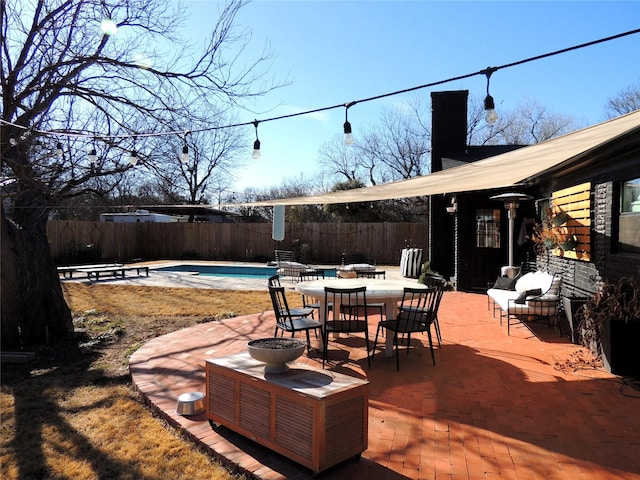 view of patio with a fenced in pool