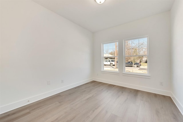 spare room with light wood-type flooring