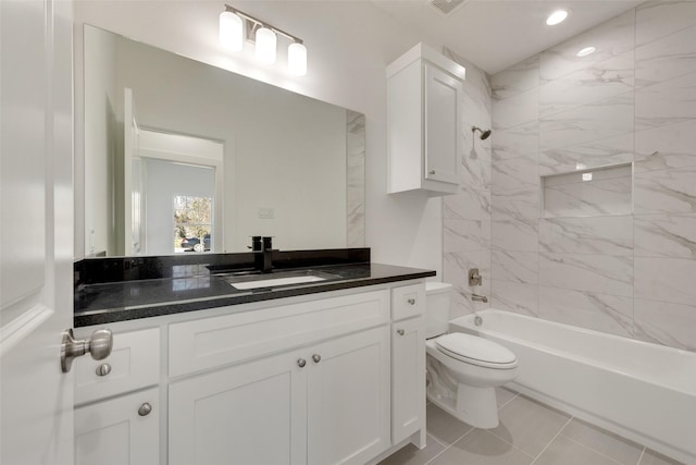 full bathroom with vanity, toilet, tiled shower / bath combo, and tile patterned flooring