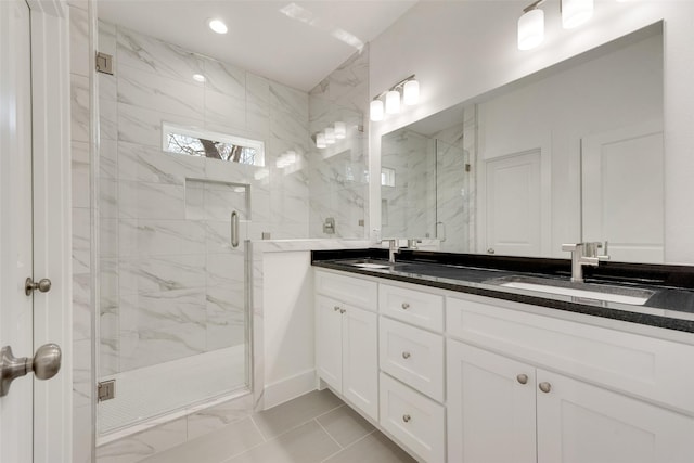 bathroom with vanity and an enclosed shower