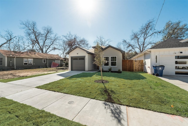 ranch-style home with a garage and a front yard