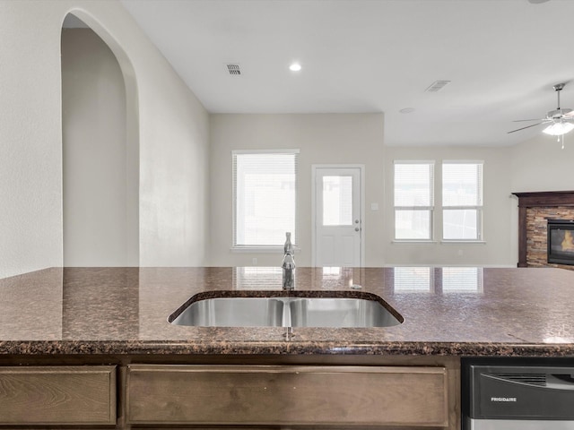 14824 Angel Trace Dr, Aledo, TX 76008 - kitchen featuring a sink, dark stone countertops, open floor plan, dishwasher, and ceiling fan