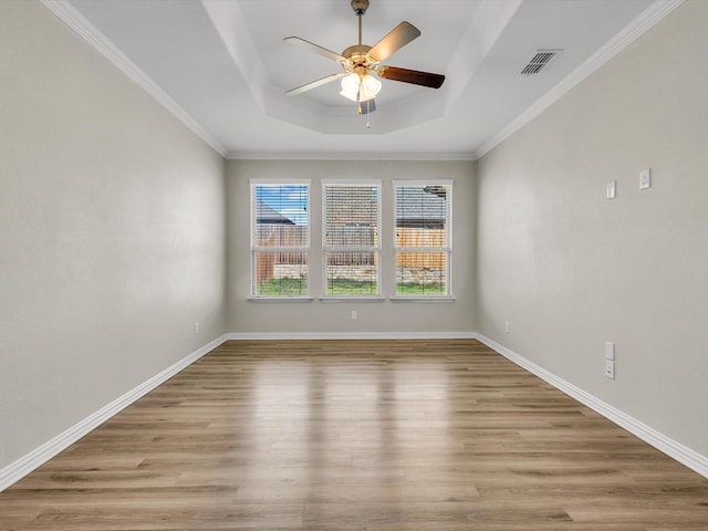 14824 Angel Trace Dr, Aledo, TX 76008 - unfurnished room featuring visible vents, a raised ceiling, ceiling fan, and light wood finished floors