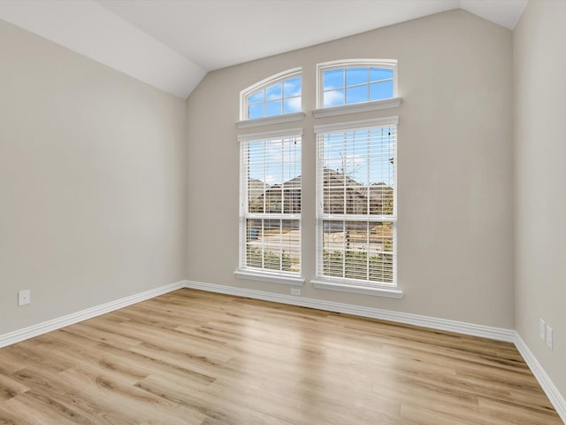 14824 Angel Trace Dr, Aledo, TX 76008 - unfurnished room featuring light wood finished floors, baseboards, and lofted ceiling