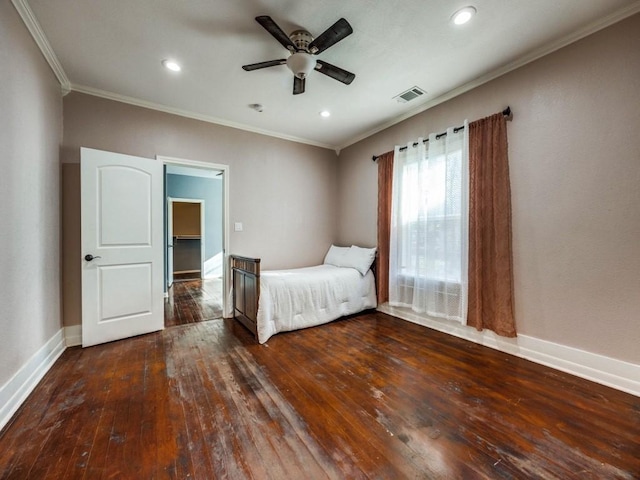 311 W Acheson St, Denison, TX 75020 - unfurnished bedroom with dark wood-type flooring, ceiling fan, and ornamental molding
