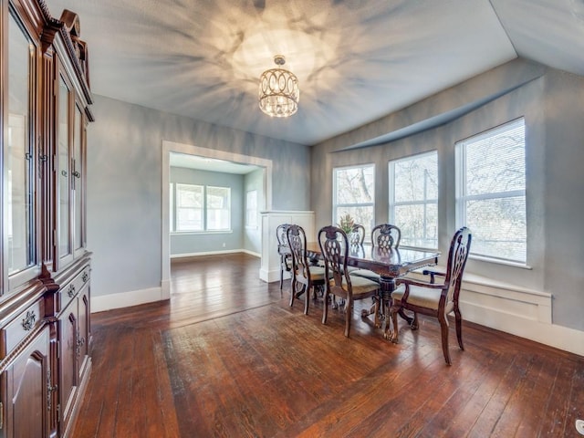 311 W Acheson St, Denison, TX 75020 - dining space with an inviting chandelier and dark hardwood / wood-style flooring